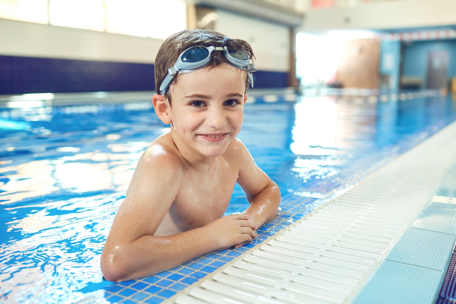 Young swimmer in the pool